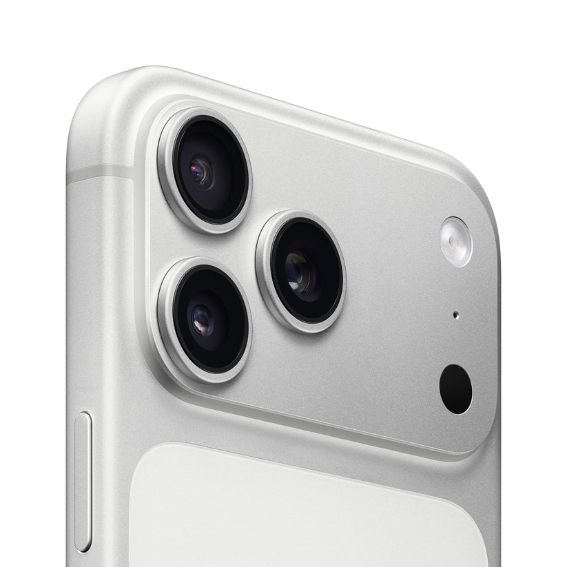A close-up view of the silver iPhone 17 Pro Max back, showcasing its triple-lens camera module, flash, and sleek metallic finish